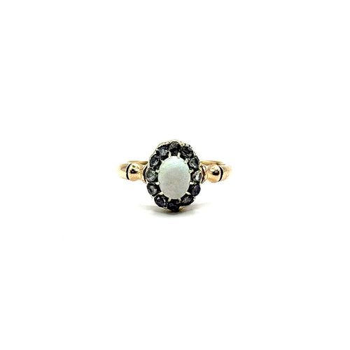 1297. Bague Art Déco en or avec diamant et opale noble