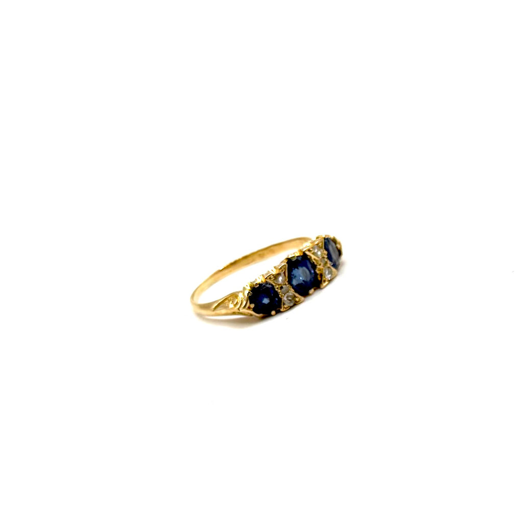 5164. Art Deco gold ring with diamonds and blue sapphire.