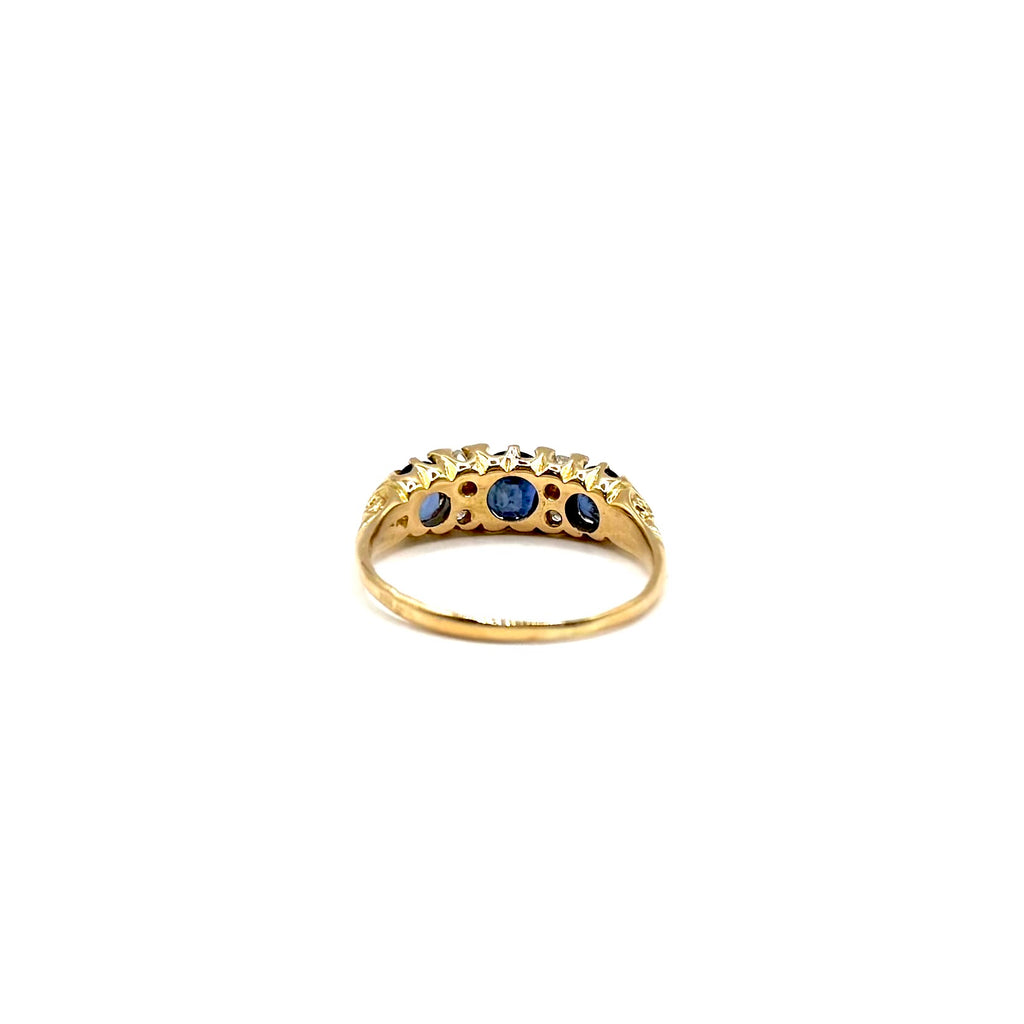 5164. Art Deco gold ring with diamonds and blue sapphire.
