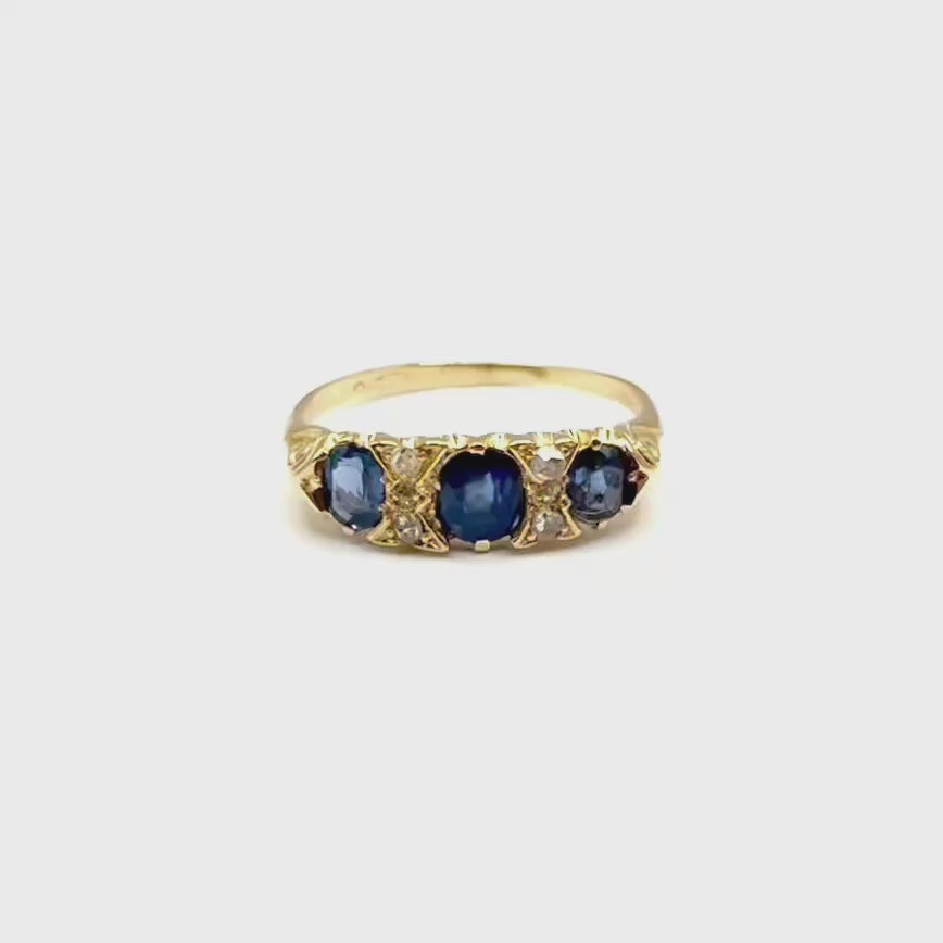 5164. Art Deco gold ring with diamonds and blue sapphire.